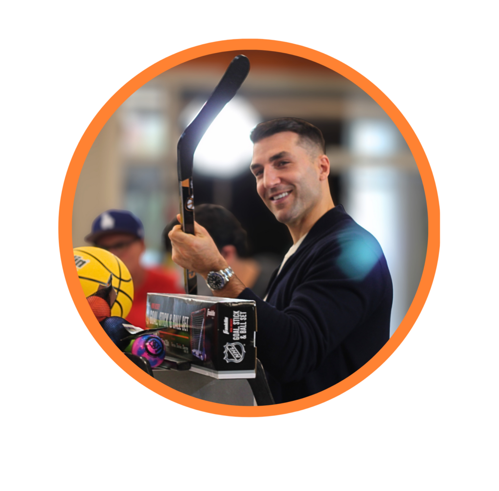 patrice bergeron holding a customized hockey stick from Franklin Sports